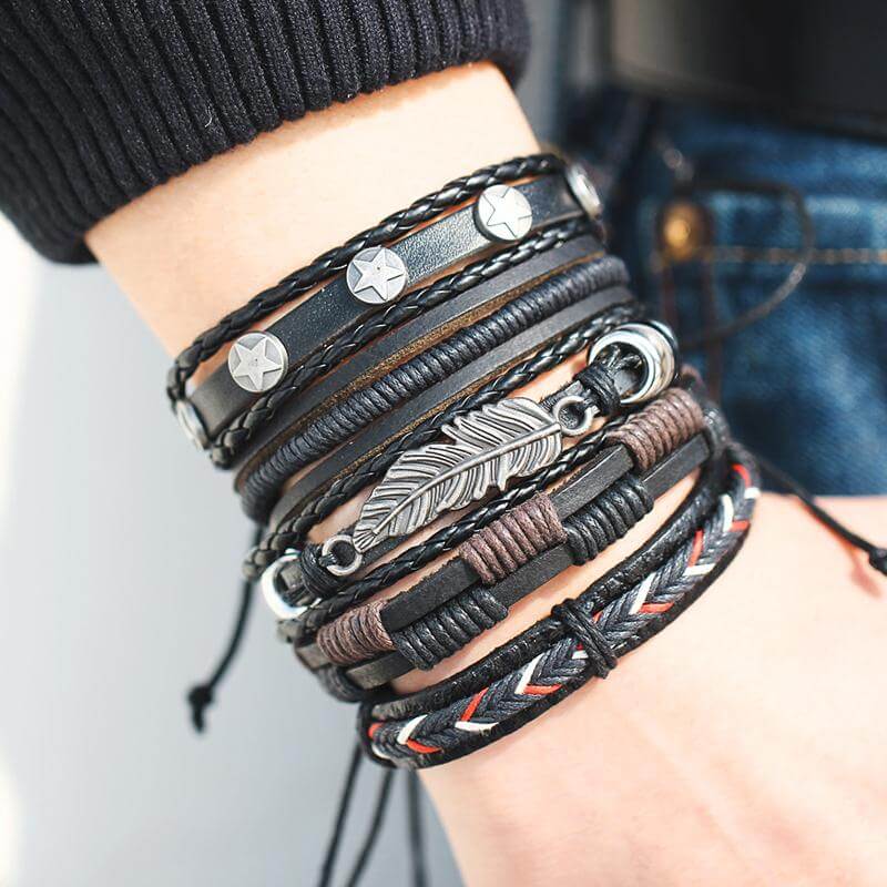 Multilayer leather bracelet for men featuring various textures and designs in black and brown tones.