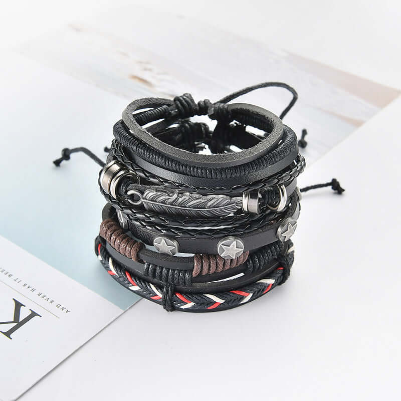 Multilayer leather bracelet for men displayed in a stack, showcasing various styles in black and brown colors.