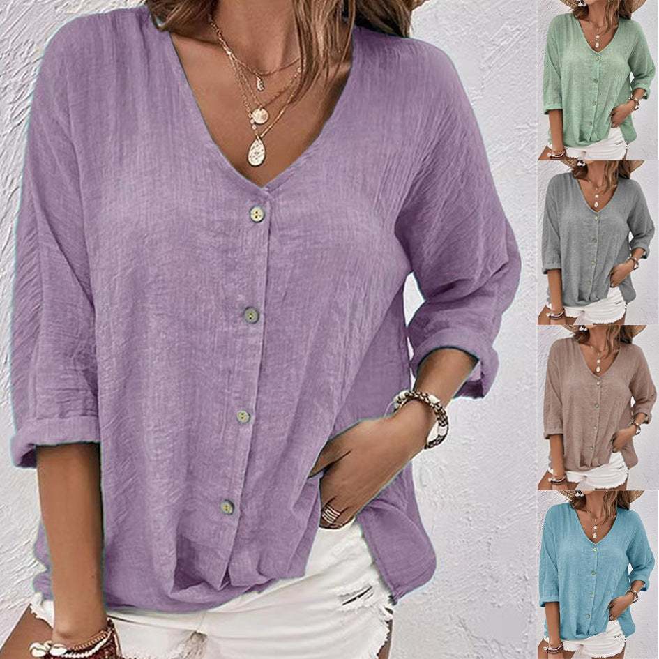 Woman wearing a solid color V-neck long-sleeved loose casual T-shirt with buttons