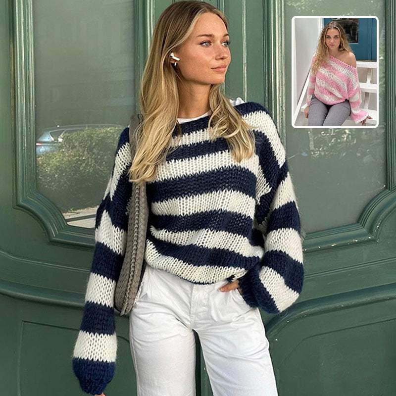 Woman wearing loose striped pullover sweater in blue and white with long sleeves